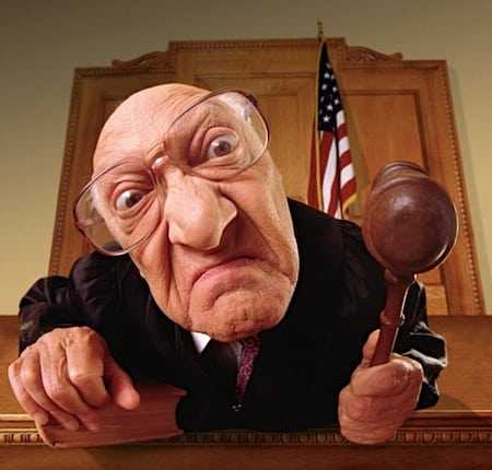 Angry old judge with hammer