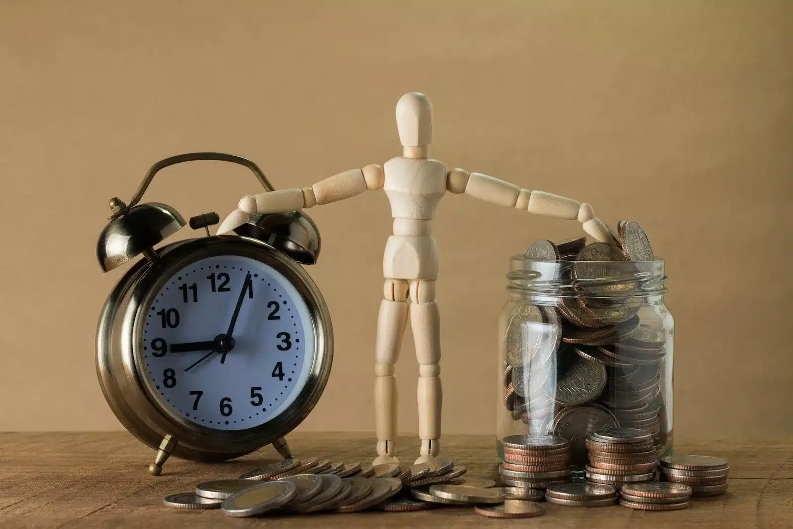 A clear glass jar filled with coins, symbolizing the concept of transparent remuneration.